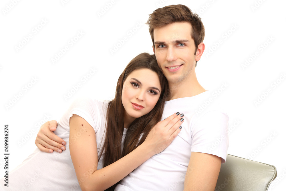 Young couple sitting together isolated on white Young couple sitting together isolated on white