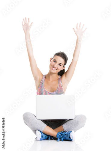 Happy student with a laptop © ikostudio