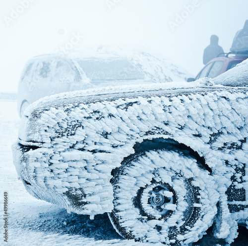 Snow covered frozen car at winter © motorangel