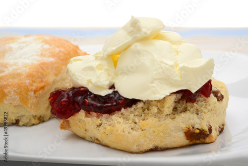 Scone with raspberry jam and cream