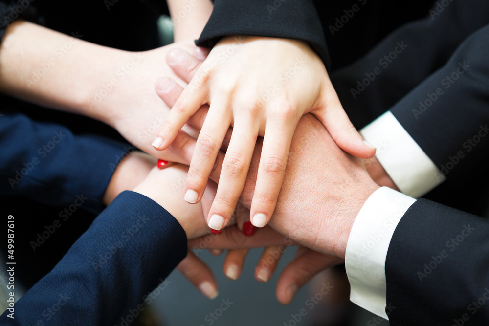 Closeup of pile of hands of business partners Closeup of pile of hands of business partners