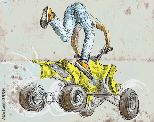 Young boy showing off freestyle trick with his ATV.