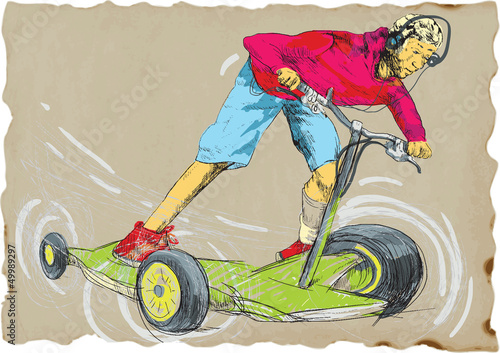young boy on a fantastic machine - special scooter or skateboard