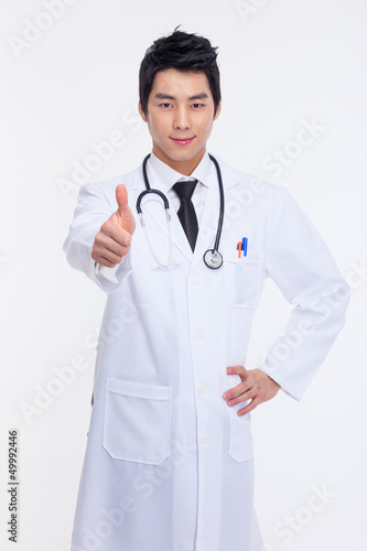 Young Asian doctor showing thumb