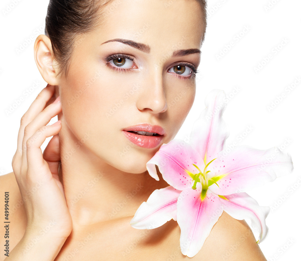 Beauty face of young woman with flower. Beauty treatment concept Beauty face of young woman with flower. Beauty treatment concept