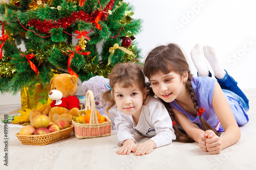 girls at a New Year tree