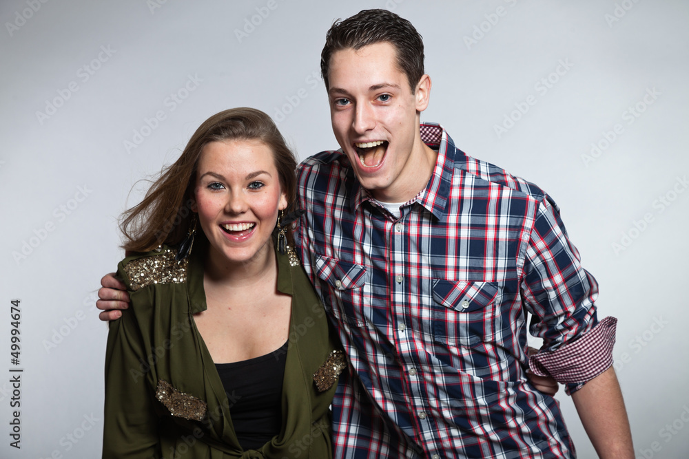 Happy young couple in love. Man and woman. Studio shot. Happy young couple in love. Man and woman. Studio shot.