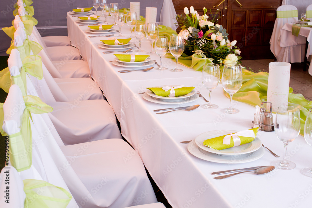 table set for wedding dinner decorated with flowers