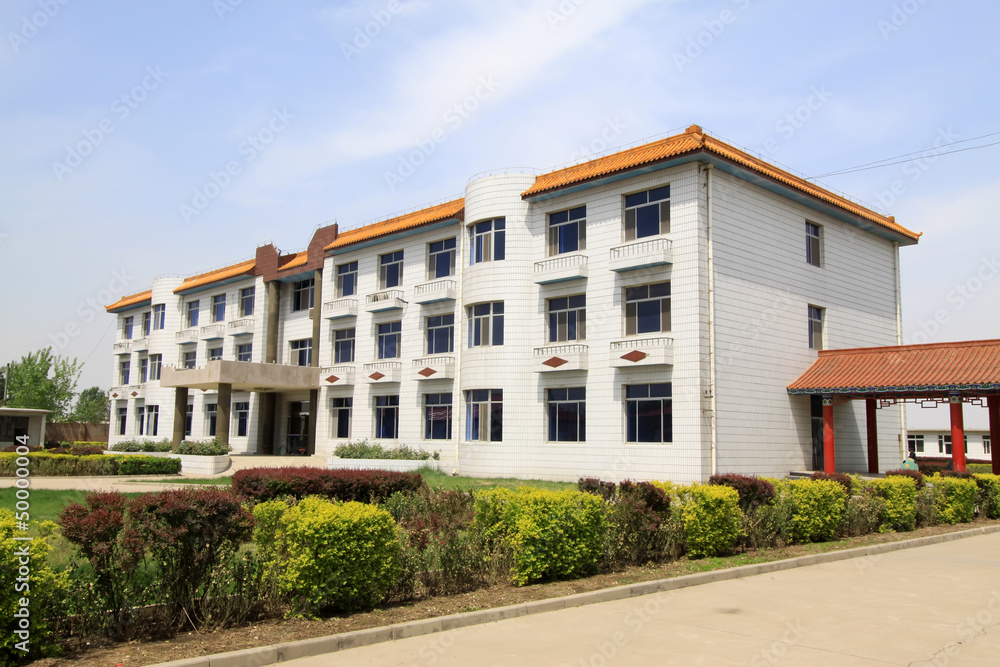 green buildings and roads in a small town green buildings and roads in a small town