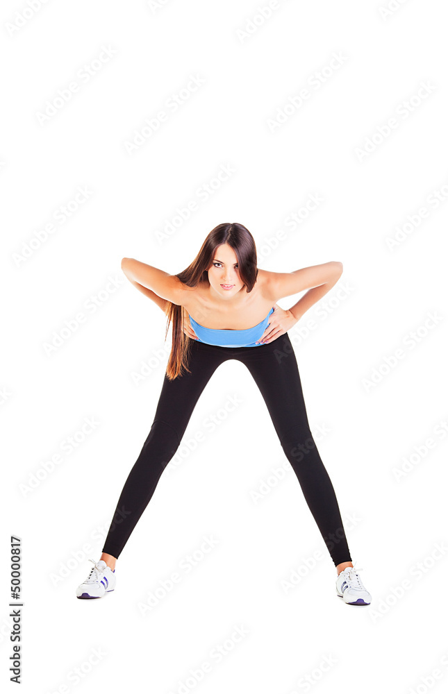 woman doing her forward bending exercise woman doing her forward bending exercise