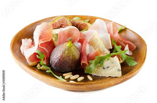 Appetizer with figs, cheese and ham