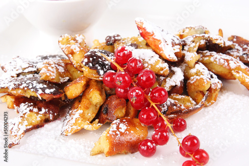 Fototapeta Naklejka Na Ścianę i Meble -  Dessert cut-up and sugared pancake with red currant - Kaiserschm