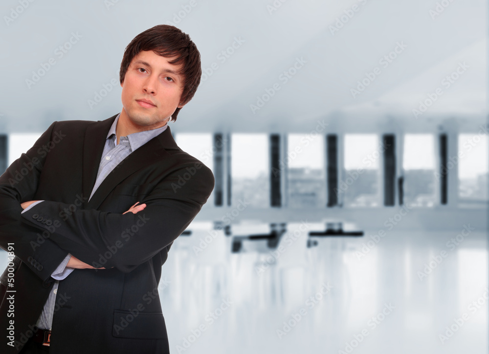Business man posing at the office Business man posing at the office