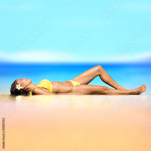 Beach vacation holiday woman in a bikini relaxing