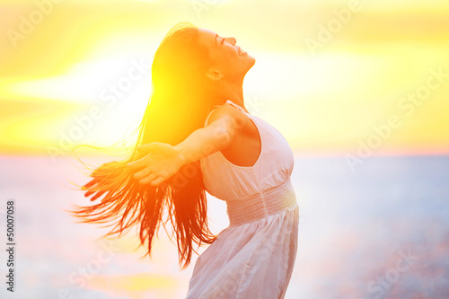 Enjoyment - free happy woman enjoying sunset photo