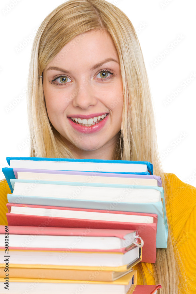 Happy student girl holding stack of books Happy student girl holding stack of books