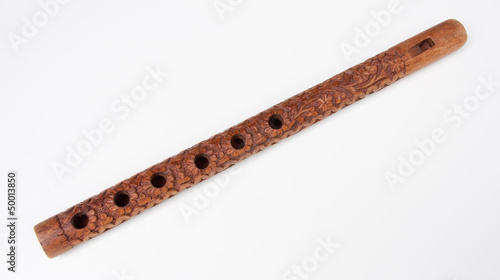 Ornately carved wooden flute