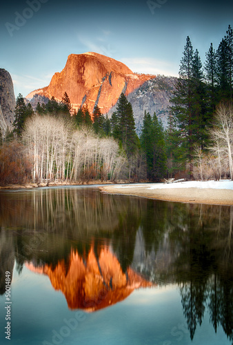 View of half dome reflected in the Merced river at Yosemite photo