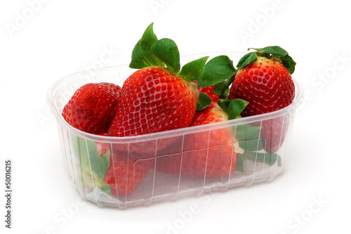 Strawberries with leaves in container