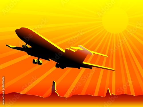 Airplane flying over desert