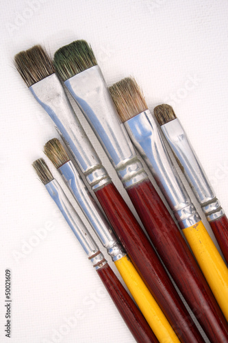 Artist brushes on canvas