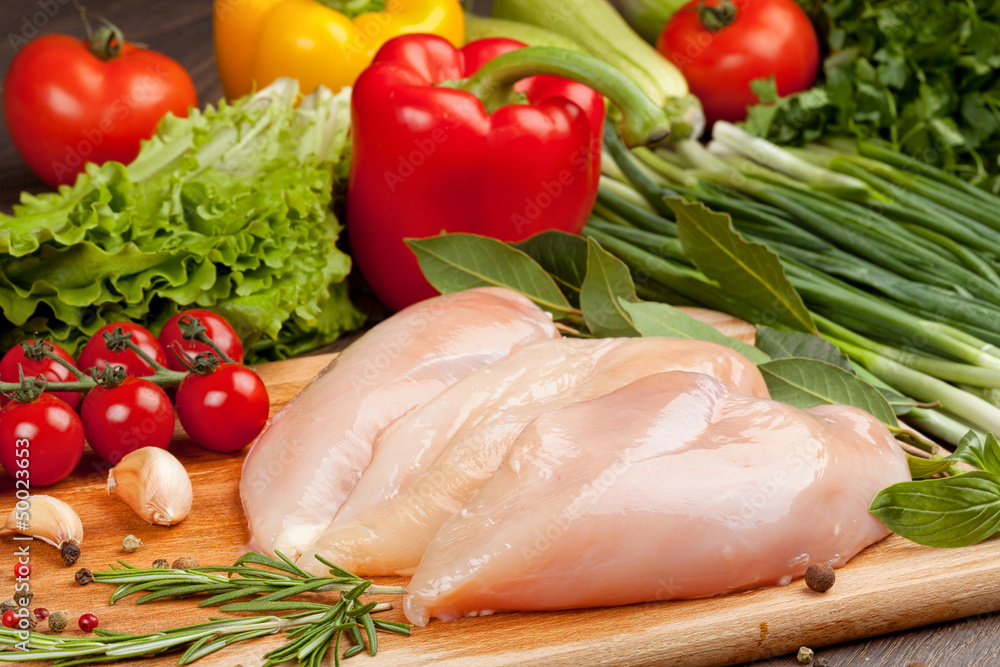 Fresh raw chicken fillet and vegetables Fresh raw chicken fillet and vegetables