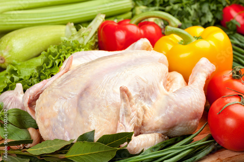 Fresh raw chicken and vegetables