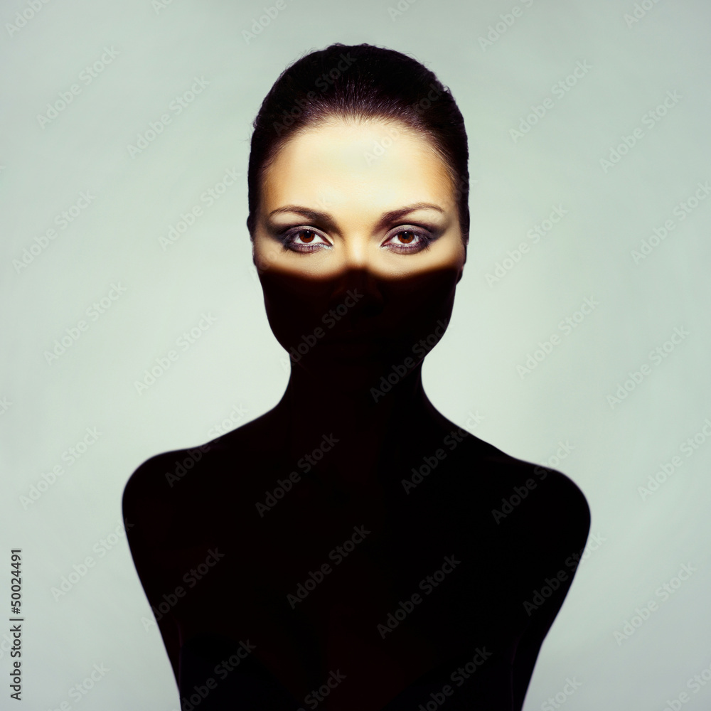 Fototapeta premium Surrealistic young lady with shadow on her body