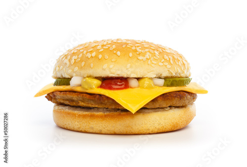 Hamburger with cheese, pickles, onion and sauce photo