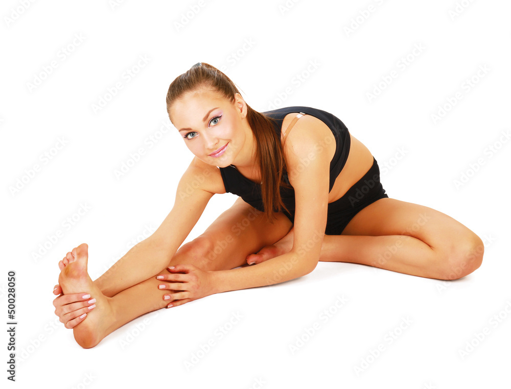 smiling woman doing stretching excersises smiling woman doing stretching excersises