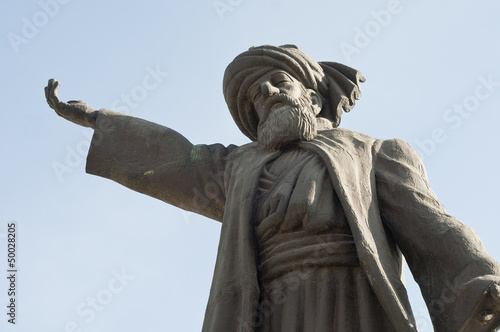 Statue of Mevlana Jalaluddin Rumi in Turkey with an open hand gesture. A symbol of philosophy, mysticism, and cultural heritage.