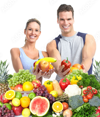 Happy couple with fruits.