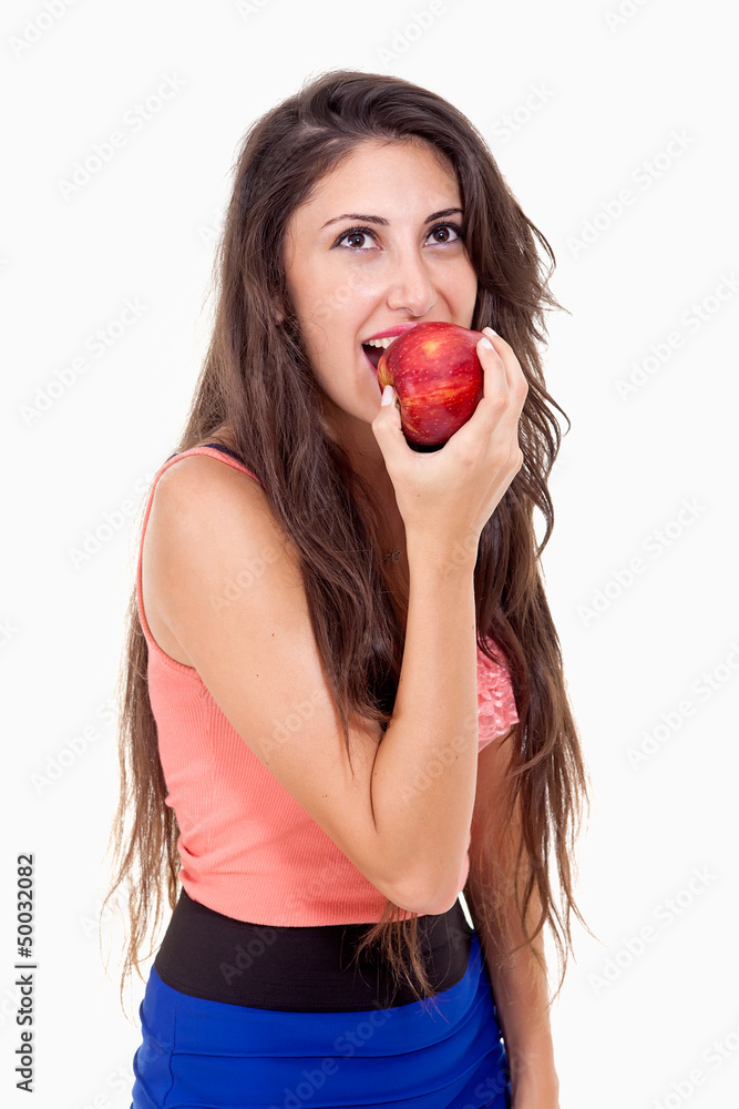 Healthy nutrition. Beautiful young woman eating a red apple.