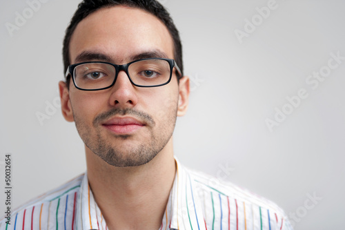 Portrait of young man with glasses © maxsaf
