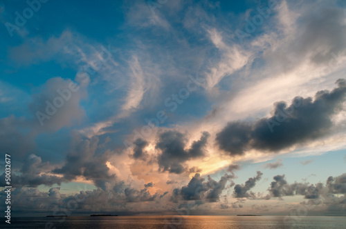 Dramatic clouds at dusk over the sea