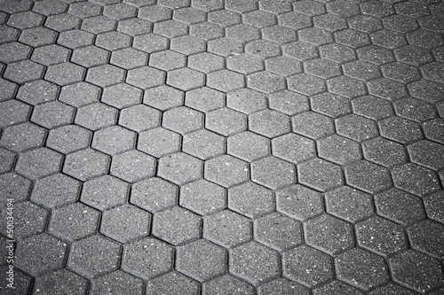 Background texture of gray cellular cobblestone road
