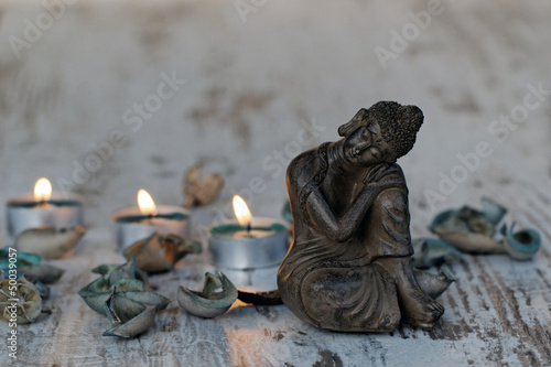 Vászonkép Buddha mit Teelichtern