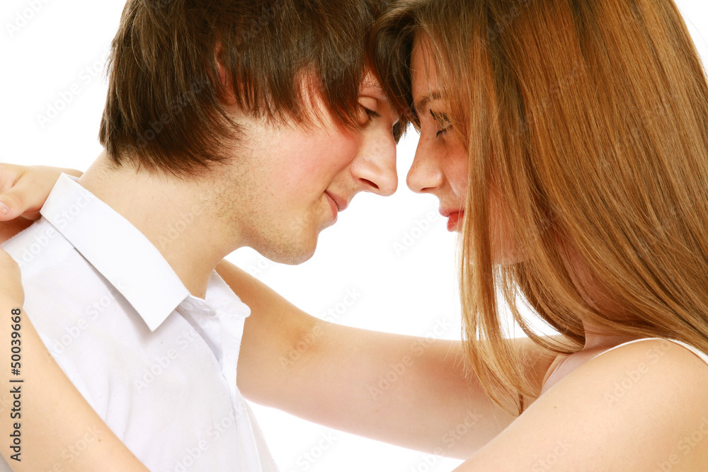 Hugging couple looking at each other face to face Hugging couple looking at each other face to face