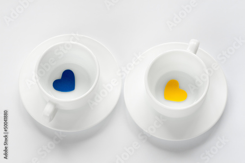 empty cup and saucer with hearts