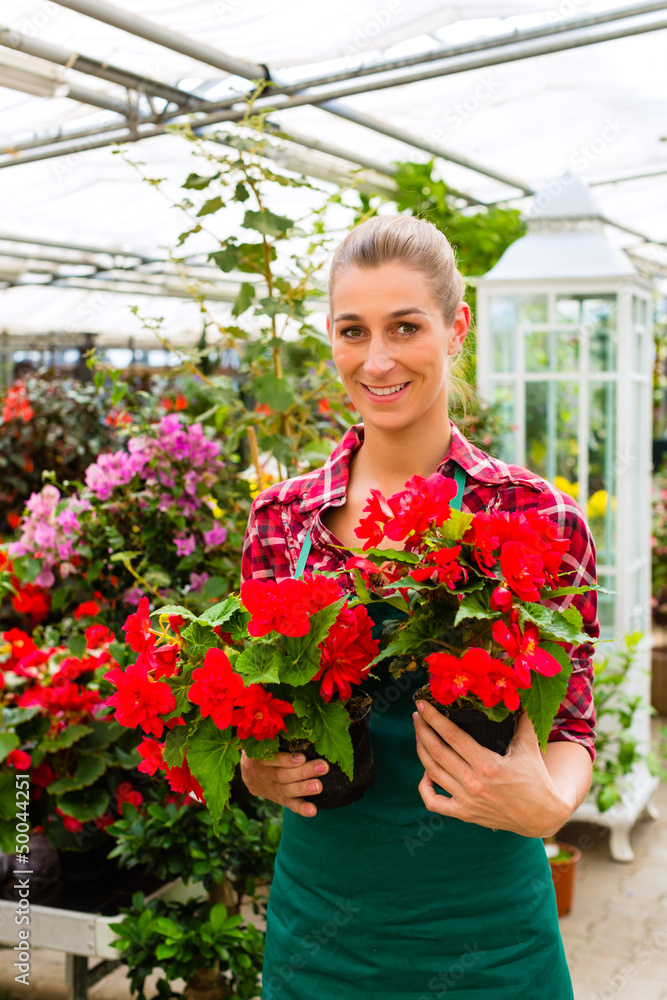 gardener in her green house flower shop