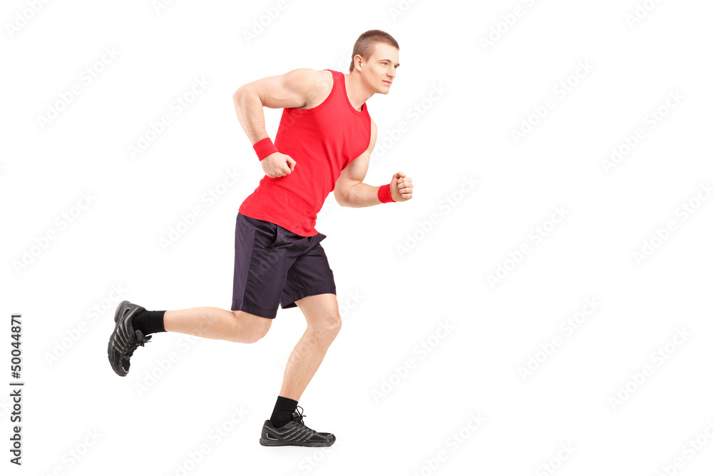 Full length portrait of a fit muscular male athlete running