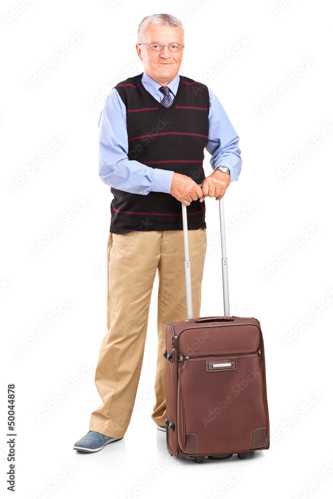 Full length portrait of a senior gentleman standing with a trave