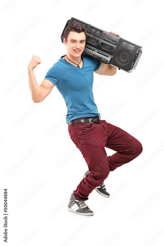 Full length portrait of a young muscular man posing with a radio Full length portrait of a young muscular man posing with a radio