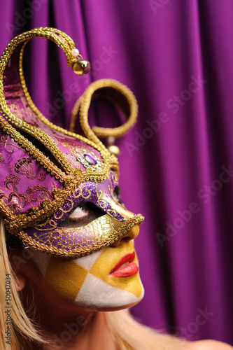 woman in violet carnival mask