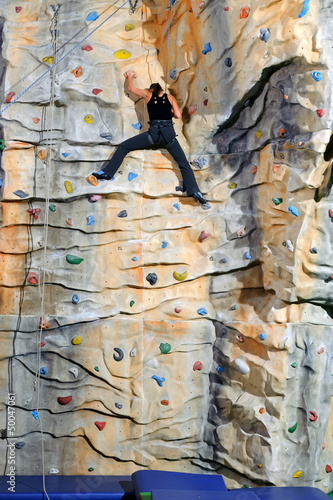 woman on rock wall