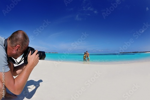 photographer taking photo on beach © .shock