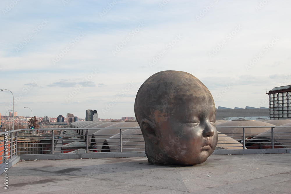 Naklejka premium baby face statue, Atocha station in Madrid