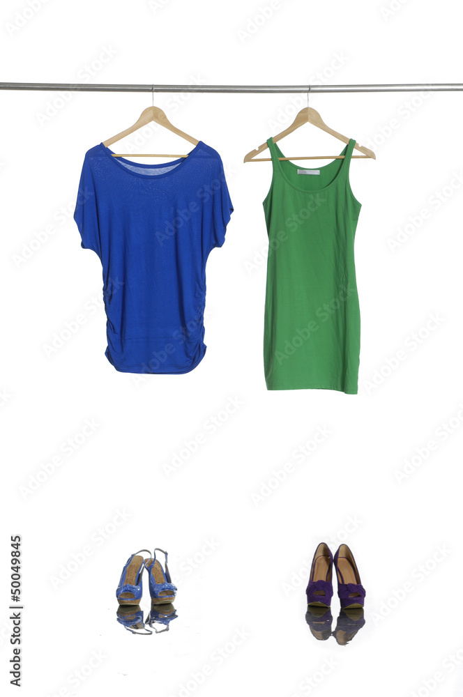 Blue and green female cloth and shoes hangers in row Blue and green female cloth and shoes hangers in row