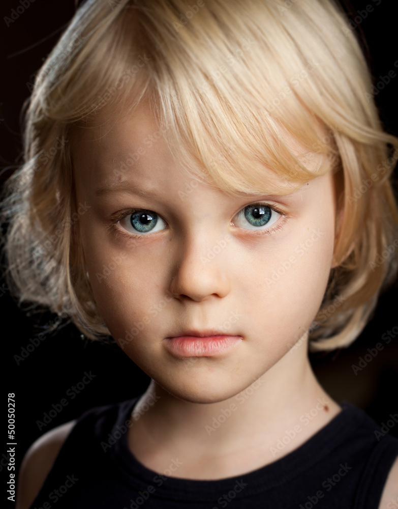 Close-up portrait of serious boy. Close-up portrait of serious boy.