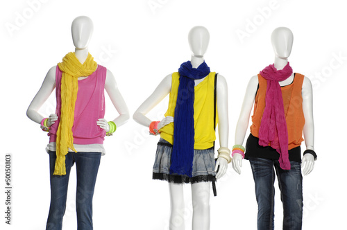 Three fashion dress with scarf on mannequin isolated